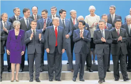  ?? AP ?? World leaders pose for a group photo at the G-20 summit in Buenos Aires.