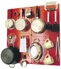  ??  ?? Wall Control offers a modular, metal pegboard system made to hold everything from small kitchen tools to beefy pots and pans. The metal pegboards are sturdier than classic ones.