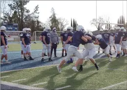  ?? SHARON MARTIN — ENTERPRISE-RECORD ?? Players from the Pleasant Valley varsity football team warm up during Friday’s practice at Asgard Yard. It was the first practice since the COVID-19 pandemic began last March.