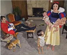  ?? DINA GOLDSTEIN ?? Snow White living with her slob husband and kids in a photograph by Dina Goldstein, whose Fallen Princesses photo series is part of the Contact Photograph­y Festival at the Gallery House until June 10.