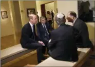  ?? DEBBIE HILL — POOL PHOTO VIA AP ?? Britain’s Prince William, left, speaks with Holocaust survivors during a tour of the Yad Vashem Holocaust Memorial Tuesday in Jerusalem.