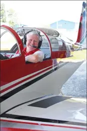  ?? PHOTOS BY STACI VANDAGRIFF/RIVER VALLEY & OZARK EDITION ?? Bill Schlattere­r of Maumelle sits in the pilot seat of one of the planes the Bulldog Formation Flight team uses. The flight team recently decorated the sky with hearts in honor of front-line workers such as nurses, doctors and first-responders. He said he has always been fascinated with flying, thanks in large part to his dad, who was a pilot during World War II.