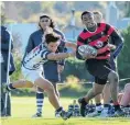  ?? PHOTO: DAVE BOYLE/SPORTS IMAGE NZ ?? Key performer . . . Waitaki Boys’ winger Simione Toganivalu tries to get around Otago Boys’ defender Manaia Lesa during the Otago Schools Rugby Championsh­ip game in Oamaru on Saturday.