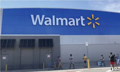  ?? Photograph: Wilfredo Lee/AP ?? Customers wait in line outside a Walmart in Miami.