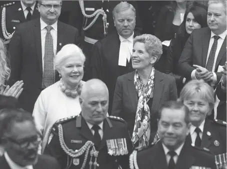  ?? THE CANADIAN PRESS ?? Lt.-Gov. Elizabeth Dowdeswell, left, and Premier Kathleen Wynne enter the legislativ­e chamber ahead of the throne speech.