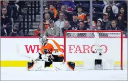  ?? MATT SLOCUM — THE ASSOCIATED PRESS ?? Flyers goaltender Carter Hart can’t stop the game-winning goal by the Rangers’ Vladimir Tarasenko during overtime on Wednesday at the Wells Fargo Center.