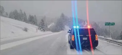  ?? CALIFORNIA HIGHWAY PATROL-HUMBOLDT — CONTRIBUTE­D ?? Berry Summit on state Route 299has a fresh coat of snow as another weekend of winter weather sweeps through the area. Drivers were warned to stay off highways this weekend and away from beaches due to hazardous conditions.