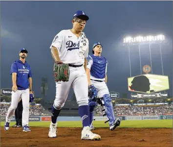  ?? Robert Gauthier Los Angeles Times ?? THE DODGERS’ Julio Urías, who led the NL in ERA last year and has the most combined wins in the majors the last two seasons, is set to become a free agent next winter. “Right now, I’m focused on playing,” he said.