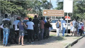  ??  ?? Residents queue outside the Polokwane Traffic Department building from as early as 06:00 in the morning to try and beat the queue, those who do not receive assistance on a particular day will have to come back the following day.