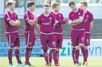  ?? Picture: SNS. ?? The Arbroath players after losing out in the penalty shoot-out.