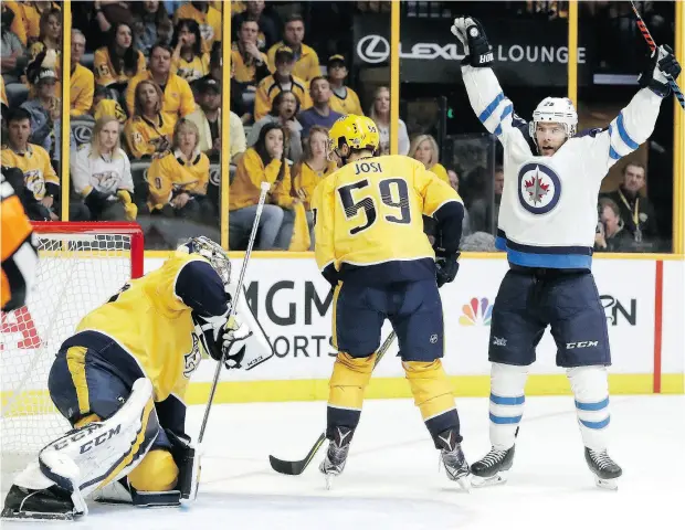  ?? MARK HUMPHREY / THE ASSOCIATED PRESS ?? Winnipeg Jets forward Paul Stastny celebrates Thursday night after teammate Tyler Myers, not shown, scored on goalie Pekka Rinne.