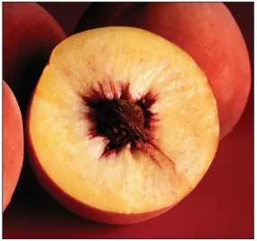  ?? (Photo by Jack Dykinga) ?? Fresh, perfectly ripe peaches are the foundation of Peach and Tomato Salad