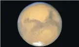  ?? THE CANADIAN PRESS/AP, NASA FILES ?? Chris Herd, co-author of a newly published paper, says scientists used to believe that Deimos and Phobos were once asteroids circling the planet Mars, above.