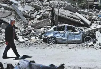  ?? AP ?? A street full of destroyed buildings in the town of Douma, the site of a suspected chemical weapons attack, near Damascus.