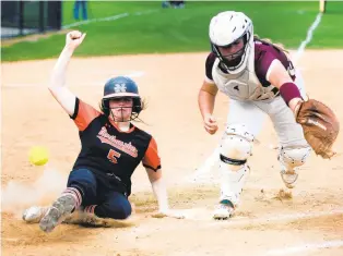  ?? RICK KINTZEL/THE MORNING CALL ?? Northampto­n baserunner Taylor Kranzley slides safe as she crosses homeplate against Whitehall on April 13 at Northampto­n Area High School. Kranzley was voted the EPC softball MVP.