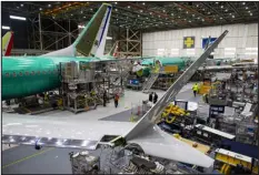  ?? RUTH FREMSON — NEW YORK TIMES FILE ?? Workers build 737Max 8planes on the assembly line at Boeing’s factory in Renton, Wash., in 2019. Problems have plagued the manufactur­er even after two fatal crashes, and many current and former employees blame the company’s focus on making planes more quickly.