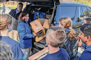  ?? Photos courtesy of Mark Adam ?? The East Greenbush Central School District rallied Saturday for a “Stuff a Bus” collection to support Ukrainains dealing with the Russian invasion. Gov. Kathy Hochul helped out. At left, East Greenbush students bring supplies destined for Ukraine.