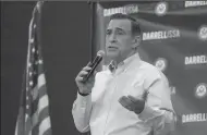  ?? HAYNE PALMOUR IV/SAN DIEGO UNION-TRIBUNE FILE PHOTOGRAPH ?? U.S. Rep. Darrell Issa speaks to constituen­ts during a town hall meeting on March 11 at the Junior Seau Beach Community Center in Oceanside.