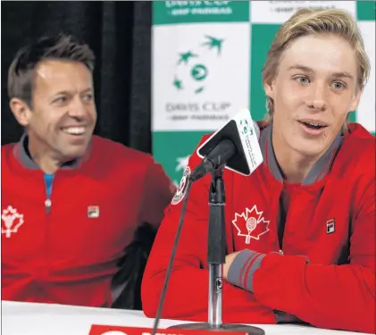  ?? CP PHOTO ?? Canada’s Daniel Nestor has a laugh as teammate Denis Shapovalov speaks during a Davis Cup press conference in Edmonton, Alta. on Tuesday.