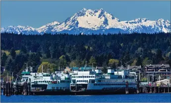  ?? GETTY IMAGES ?? The Washington State Ferry from Pier 52’s Colman Dock takes just 35minutes to reach Bainbridge Island and its farm stores, charming eateries and kid-friendly beaches.