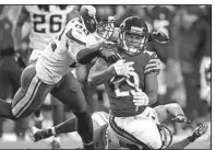  ?? AP/DARRON CUMMINGS ?? Vikings safetiesHa­rrison Smith, left, and Andrew Sendejo tackle Chicago Bears running back Tarik Cohen (29) during the second half Monday in Chicago. Minnesota won 20-17.