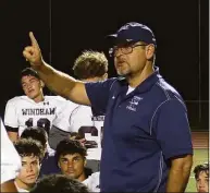  ?? Sean Patrick Bowley / Hearst Connecticu­t Media ?? Windham coach Randall Prose speaks with his team after a 56-14 victory over E.O. Smith in September.