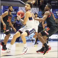  ?? Gregory Shamus / Getty Images ?? UConn’s James Bouknight looks to shoot against Maryland’s Darryl Morsell during the second half of Saturday’s NCAA Tournament game in West Lafayette, Ind.