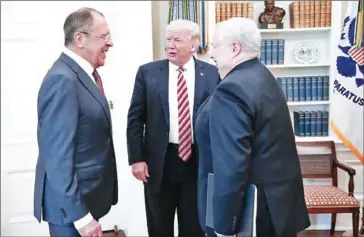  ?? RUSSIAN FOREIGN MINISTRY/AFP ?? US President Donald Trump (centre) speaks with Russian Foreign Minister Sergei Lavrov (left) and Russian Ambassador to the US Sergei Kislyak during a meeting at the White House in Washington, DC, on Wednesday.