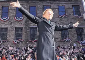  ?? ELISE AMENDOLA/ASSOCIATED PRESS ?? Sen. Elizabeth Warren, D-Mass., acknowledg­es cheers as she takes the stage during an event to formally launch her presidenti­al campaign Saturday in Lawrence, Mass.