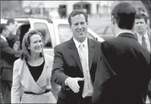  ?? AP/ERIC GAY ?? Republican presidenti­al candidate Rick Santorum (center) and his wife, Karen, arrive at Sweet Peppers Deli on Sunday during a campaign stop in Tupelo, Miss.