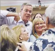  ?? Ethan Miller
Getty Images ?? JEB BUSH greets attendees after a town hall meeting in Henderson, Nev. He will travel to Charleston, S.C., on Monday to meet with black ministers.