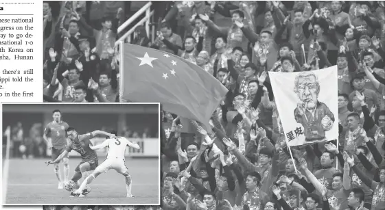  ?? Photos: Cui Meng/ GT ?? Main: Chinese fans cheer from the stands during China’s World Cup qualifier against South Korea on Thursday in Changsha, Hunan Province. Inset: Chinese forward Yu Dabao ( No. 22) controls the ball during their World Cup qualifier against South Korea on...