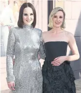  ?? ARTURO HOLMES GETTY IMAGES Michelle Dockery, left, and Laura Carmichael at the “Downton Abbey: A New Era” New York premiere. ??