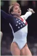  ?? AP ?? Kerri Strug reacts after injuring her left leg during a landing in competitio­n at the Atlanta Games on July 23, 1996.