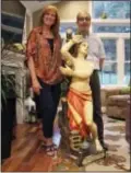  ?? EMMA LEE — WHYY VIA AP ?? In this photo provided by WHYY, Ed and Kathleen Nader stand in their living room in Exton, Pa, with a statue of St. Pantaleon that has been in Ed’s family for four generation­s. The nearly life-sized statue missing for decades from an Italian church is...