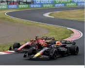  ?? ?? After his first stop Verstappen easily retook the lead from Leclerc, who was running long