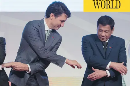  ?? ADRIAN WYLD / THE CANADIAN PRESS ?? Prime Minister Justin Trudeau shakes hands with Philippine President Rodrigo Duterte during an event at the ASEAN summit in Manila, Tuesday. Trudeau said he raised concerns about human rights abuses and extrajudic­ial killings in Duterte’s anti-drug...