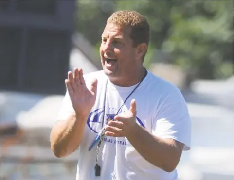  ?? Autumn Driscoll / Autumn Driscoll ?? Harding High football coach Jack Cochran watches the action during a scrimmage with Naugatuck on Aug. 24, 2013, in Bridgeport.