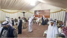 ?? — AFP ?? Kuwaitis attend an electoral campaign meeting in Kuwait City ahead of the upcoming election.