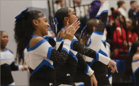  ?? LIBBY O’NEILL — BOSTON HERALD ?? Holbrook cheerleade­rs celebrate on the sidelines during their school’s girls basketball win over Avon on Friday night.