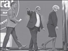  ?? CP PHOTO ?? MP Francis Drouin, left, follows Agricultur­e Minister Lawrence Macaulay and his wife Frances, after moderating a talk about their rural life experience, at the federal Liberal national convention in Halifax last month. Drouin, accused of sexual assault...