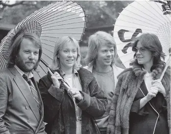  ?? THE ASSOCIATED PRESS ?? It is now acceptable to declare your love for ABBA — the band that brought you classics such as Dancing Queen and Mamma Mia. Fans of Benny Andersson, left, Agnetha Faltskog, Bjorn Ulvaeus and Anni-Frid Lyngstad no longer need to listen to their CDs...