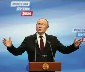  ?? ALEXANDER ZEMLIANICH­ENKO / AP ?? Russian President Vladimir Putin speaks during a visit to his campaign headquarte­rs after a presidenti­al election in Moscow early Monday.