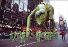  ?? MARK D. PHILLIPS / AP / FILE ?? Kermit the Frog droops after a puncture in his head lets out the oxygenheli­um mixture in the balloon during the 65th annual Macy’s Thanksgivi­ng Day Parade in New York City on Nov. 28, 1991.