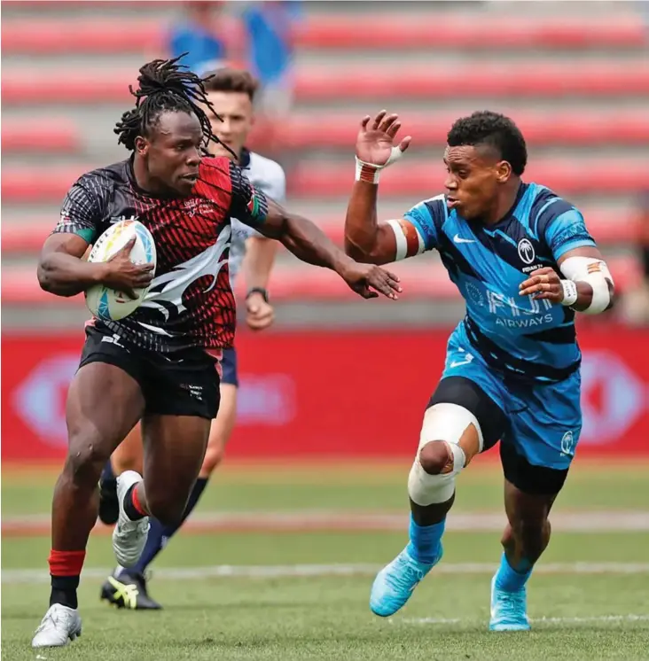  ?? Photo: World Rugby ?? Fiji Airways Fijian 7s playmaker Napolioni Bolaca (right) on his way to stop Kenya’s Arcadias Huku in their pool clash of the France Sevens in Toulouse on May 21, 2022. Bolaca who is on secondment from the Swire Shipping Fijian Drua made a try saving tackle in the 19-17 win over USA in the Cup quarterfin­als.