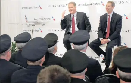  ?? PICTURE: REUTERS ?? BIG BUSINESS: US Airways chief executive Doug Parker, left, and American Airlines chairman, president and chief executive Tom Horton announce the planned merger of AMR, the parent of American Airlines, with US Airways during a news conference at Dallas...