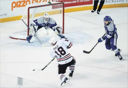  ?? JULIE JOCSAK
THE ST. CATHARINES STANDARD ?? Goaltender Ukko-Pekka Luukkonen defends the Sudbury net against Niagara’s Matthew Philip in Ontario Hockey League action Thursday night.