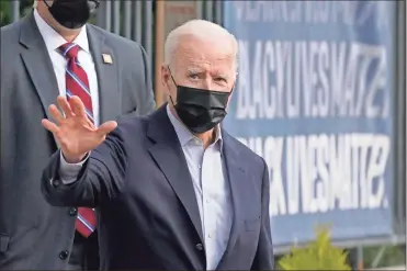  ?? Ap-patrick semansky, File ?? President Joe Biden waves as he departs after attending Mass at Holy Trinity Catholic Church in the Georgetown neighborho­od of Washington on April 10.