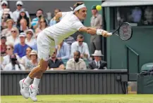  ?? Alastair Grant / Associated Press ?? Roger Federer didn’t have to extend himself Tuesday, playing only 12 games in order to advance to the second round.