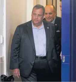  ?? GETTY IMAGES FILE PHOTO ?? Former New Jersey Gov. Chris Christie, with former New York Mayor Rudy Giuliani pictured behind, checked himself into hospital experienci­ng COVID-19 symptoms.